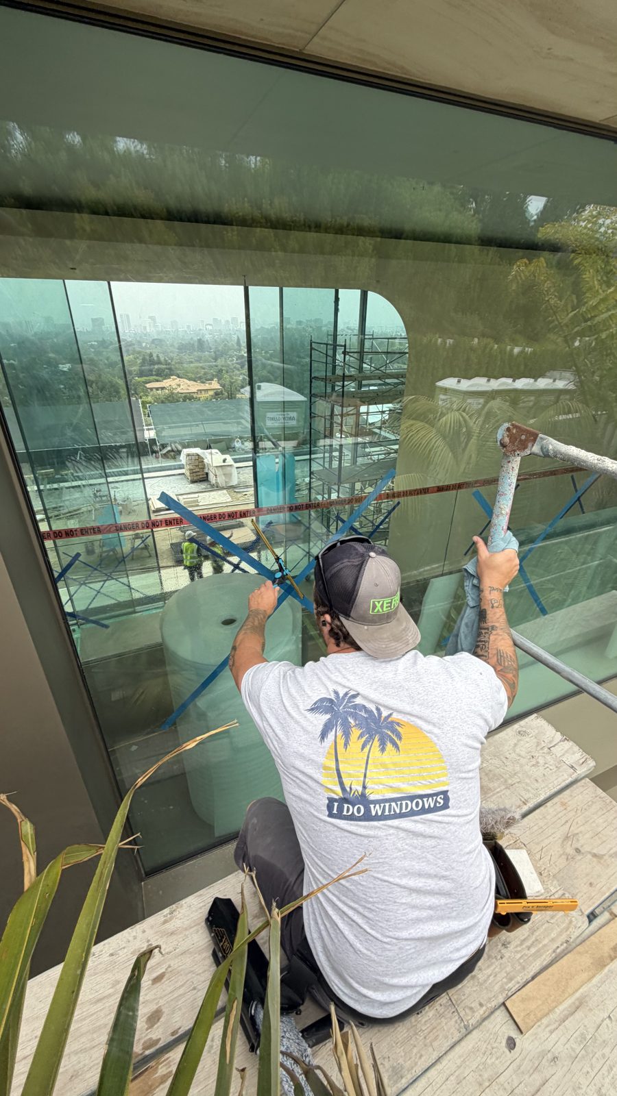 I Do Windows technician squeegeeing glass in California