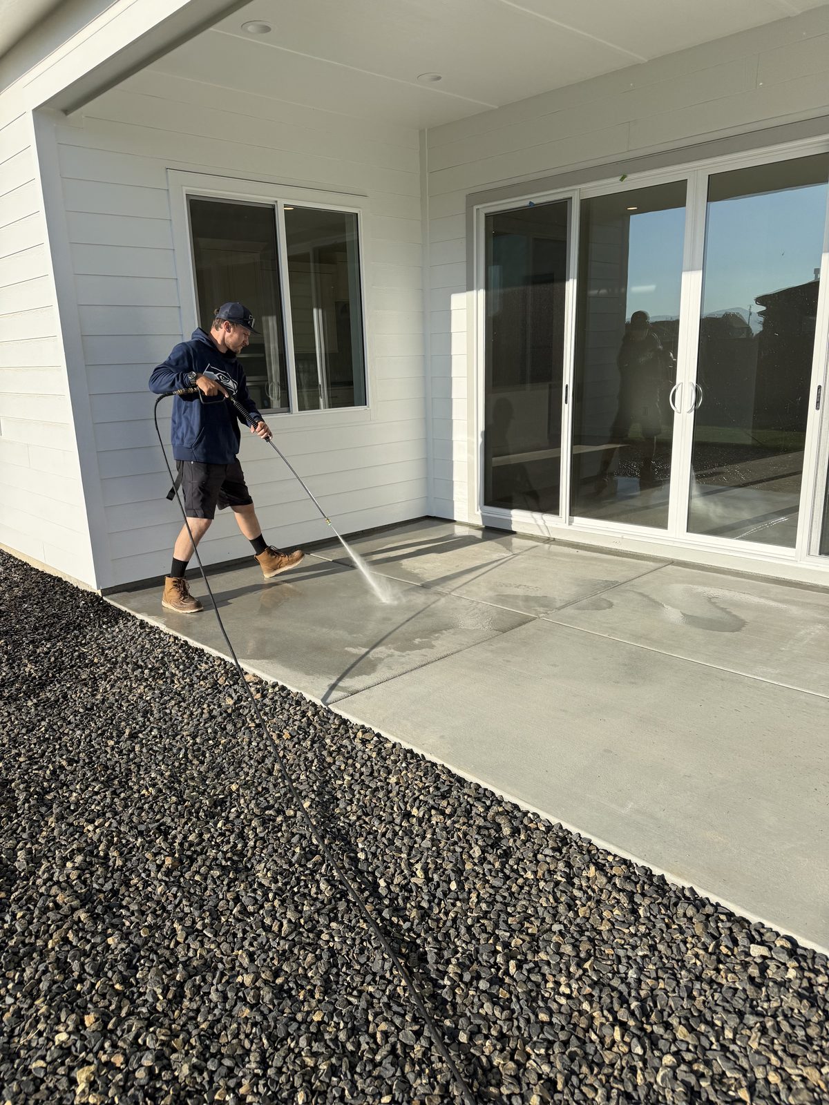 Pressure washing a home's patio in the Treasure Valley